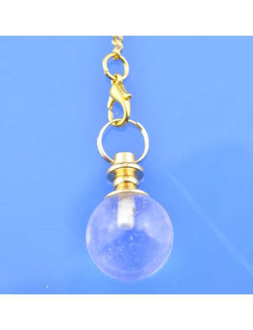 Pendule sphère en pierre et chaîne dorée